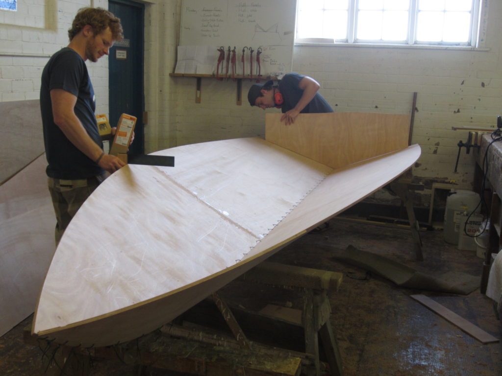 Image of Joe and Alex working on their boat