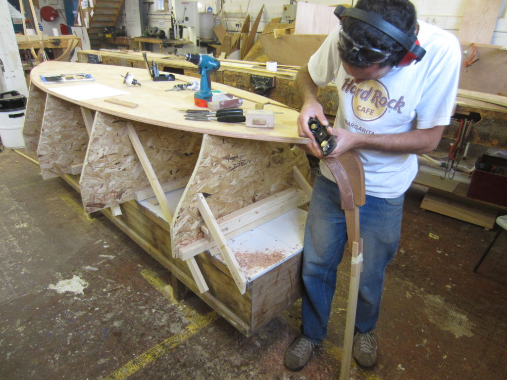 nigel working on his boat with a power tool