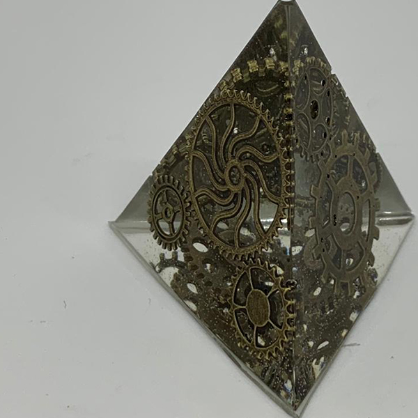 a pyramid with cogs in, made with the best quality clear casting epoxy resin: ENTROPY RESINS