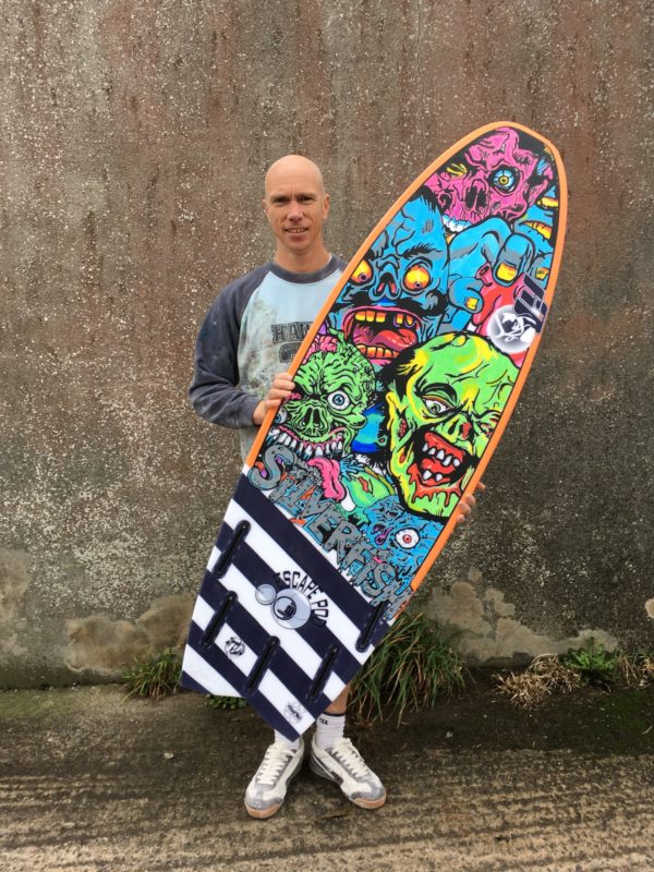 Luke Young and his magnificent artwork on a board