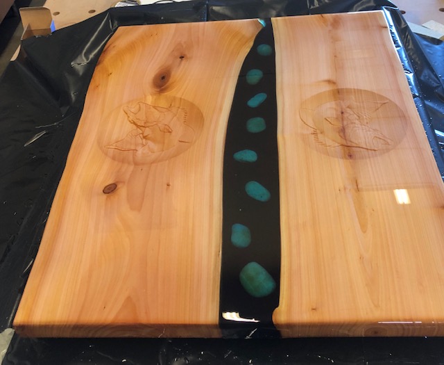 A river table made with stunning clear Entropy Resins epoxy