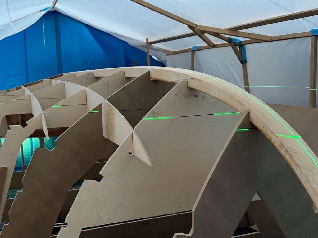 The lasers lining up the wooden cut outs for Ocracoke 20-B build