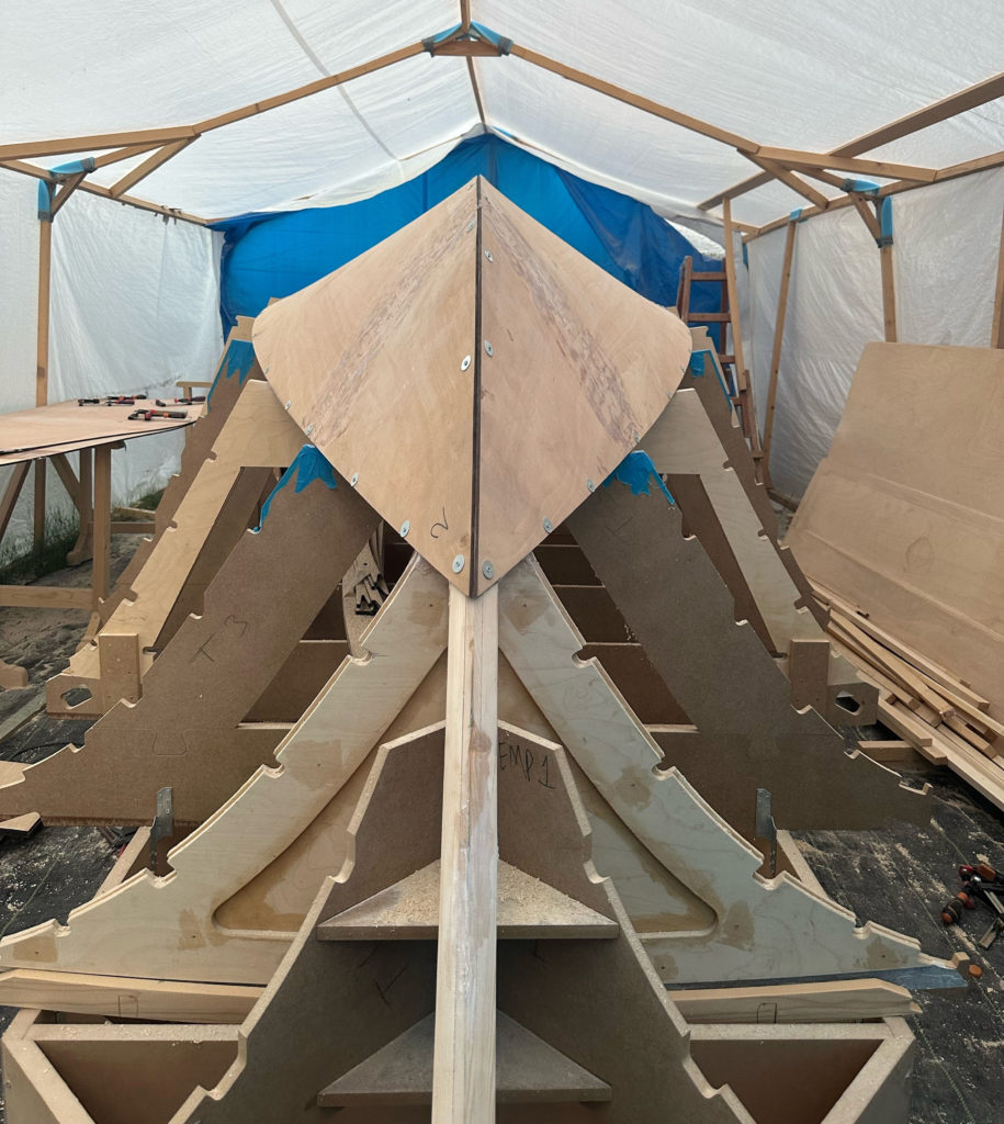 Ocracoke 20-B being built in the workshop in a hot climate