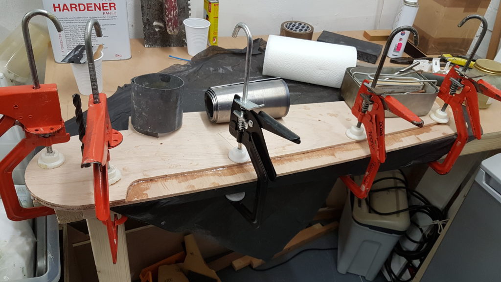 Keeping the rudder laminations flat on the swallow yachts flat pack cut out using west system epoxy to hold it together