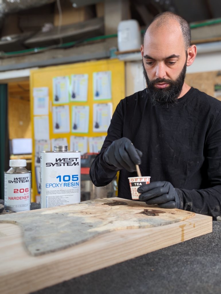 OD Guitars applying west system 105 epoxy resin and west system slow hardener to his wooden guitar