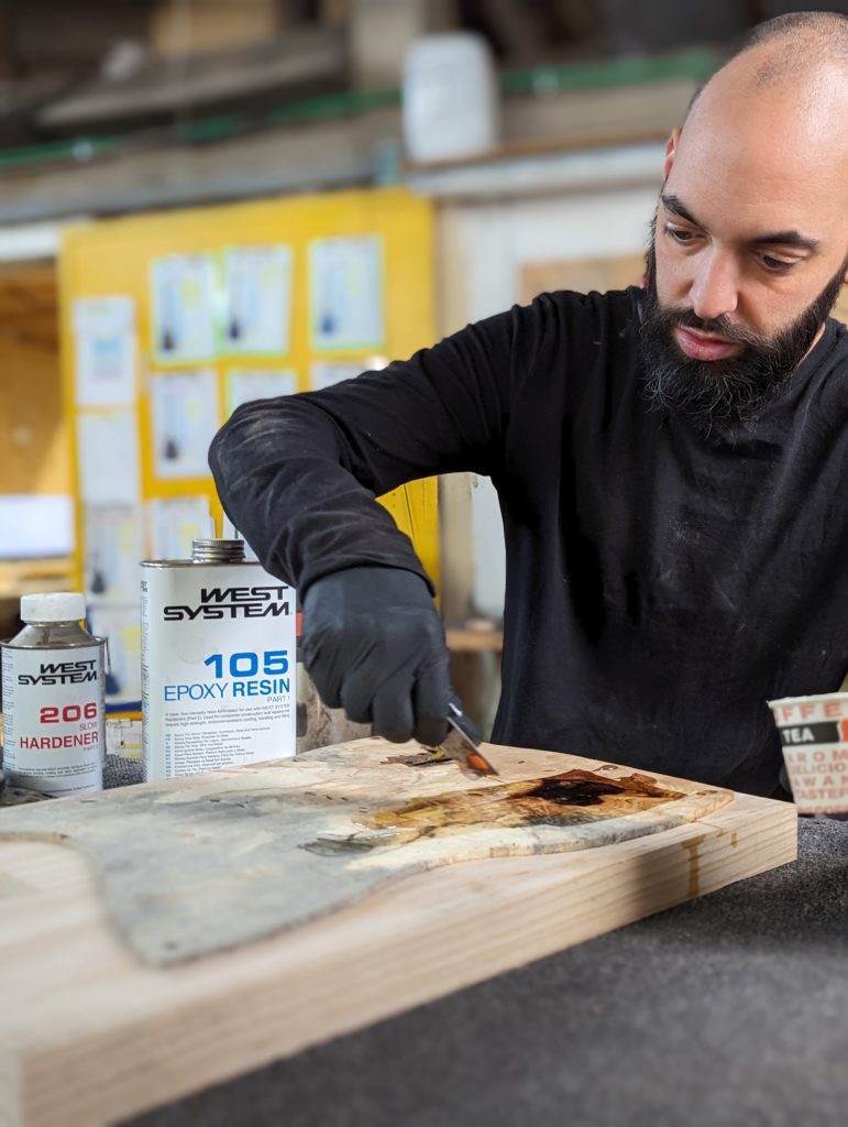 OD Guitars applying west system 105 epoxy resin and west system slow hardener to his wooden guitar