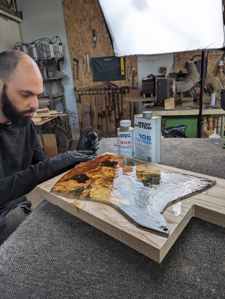 OD Guitars applying west system 105 epoxy resin and west system slow hardener to his wooden guitar