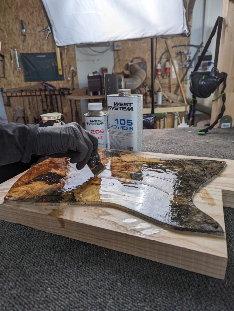 OD Guitars applying west system 105 epoxy resin and west system slow hardener to his wooden guitar