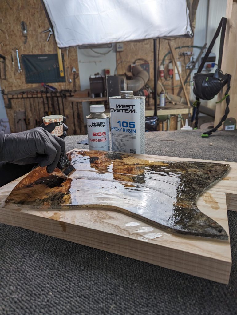 OD Guitars applying west system 105 epoxy resin and west system slow hardener to his wooden guitar