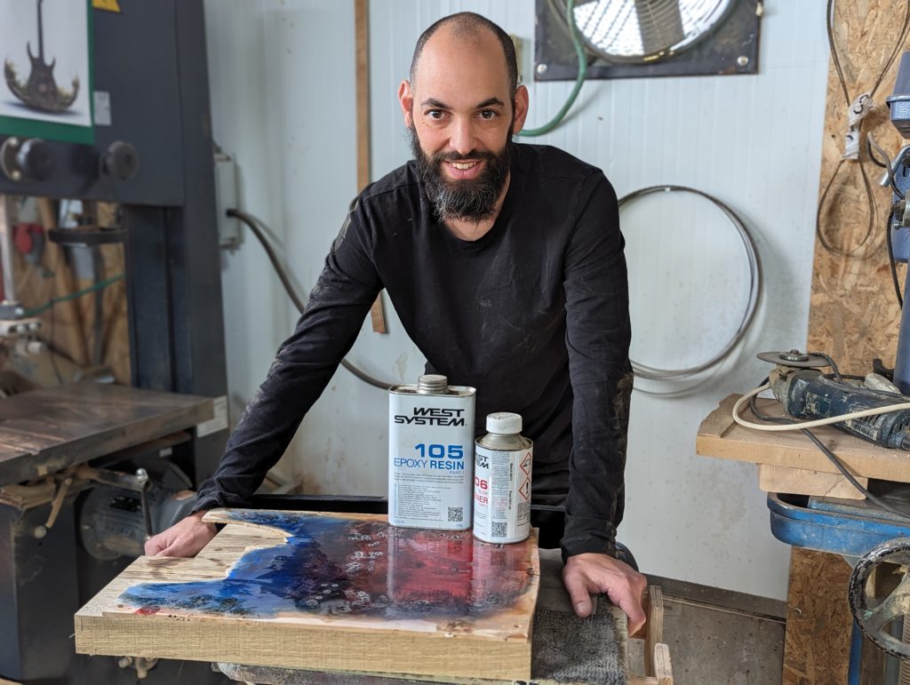OD Guitars applying west system 105 epoxy resin and west system slow hardener to his wooden guitar