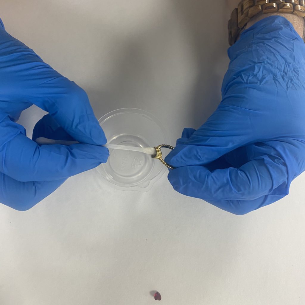 Removing the dust from the ring using solvent