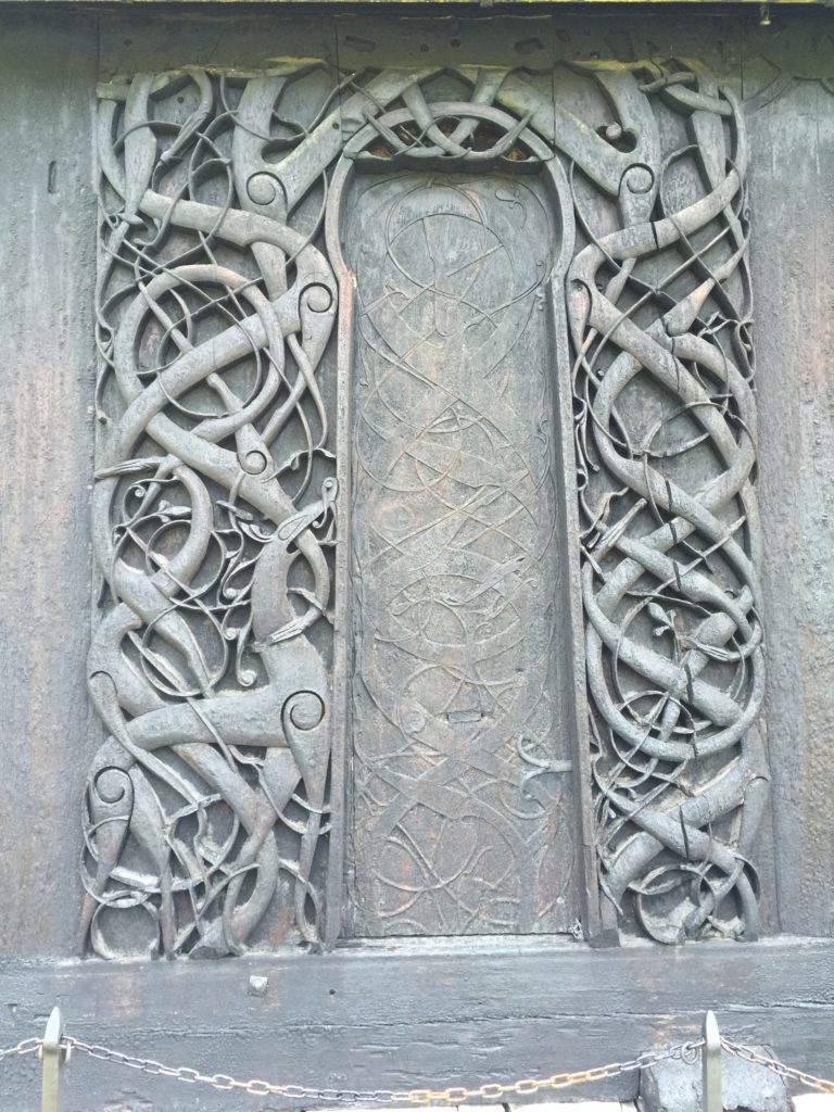 Urns stave church’s dragon carving, inspirating for Chris' woodwork epoxy projects