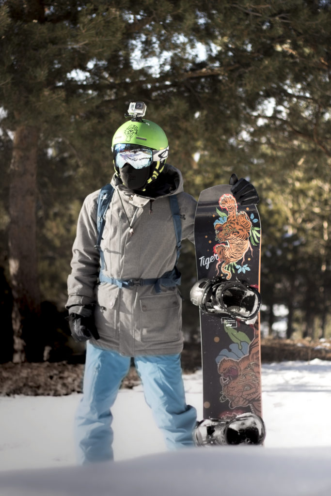 a customer stood with their 'tiger' mas snowboard made from entropy resin epoxy resin.