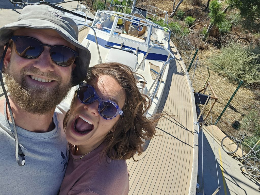 couple in front of their boat made with west system epoxy