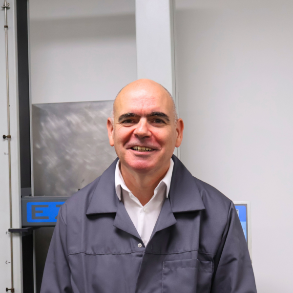 Headshot of Wessex Resins employee Hugh Roarty in a lab coat