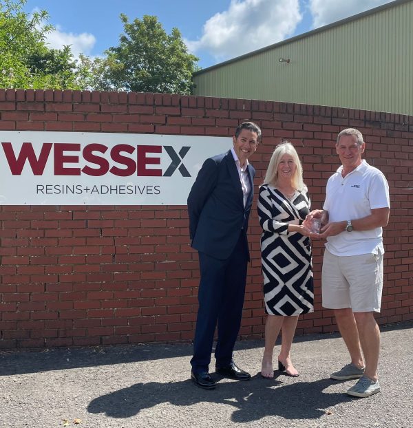 Presenting award outside Wessex Resins & Adhesives building
