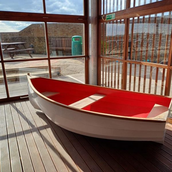 Wooden boat inside on a sunny day