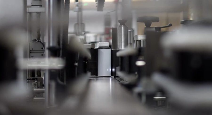 Conveyor belt carrying bottles in the Wessex Resins factory