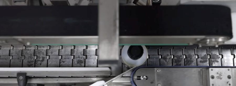 Conveyor belt carrying bottles in the Wessex Resins factory