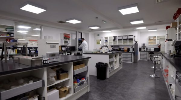 The Wessex Resins laboratory showing multiple counters and scientific machinery, a scientist works in the background